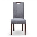 Krzesło tapicerowane z wysokim oparciem. Wygodny mebel do jadalni i nie tylko